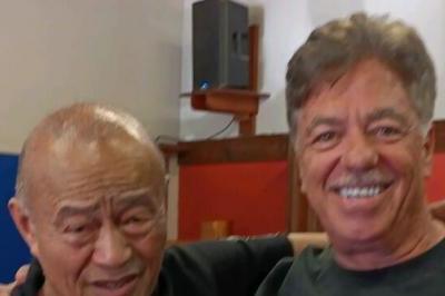 Guru Inosanto and Sifu McElroy standing with arms around shoulders